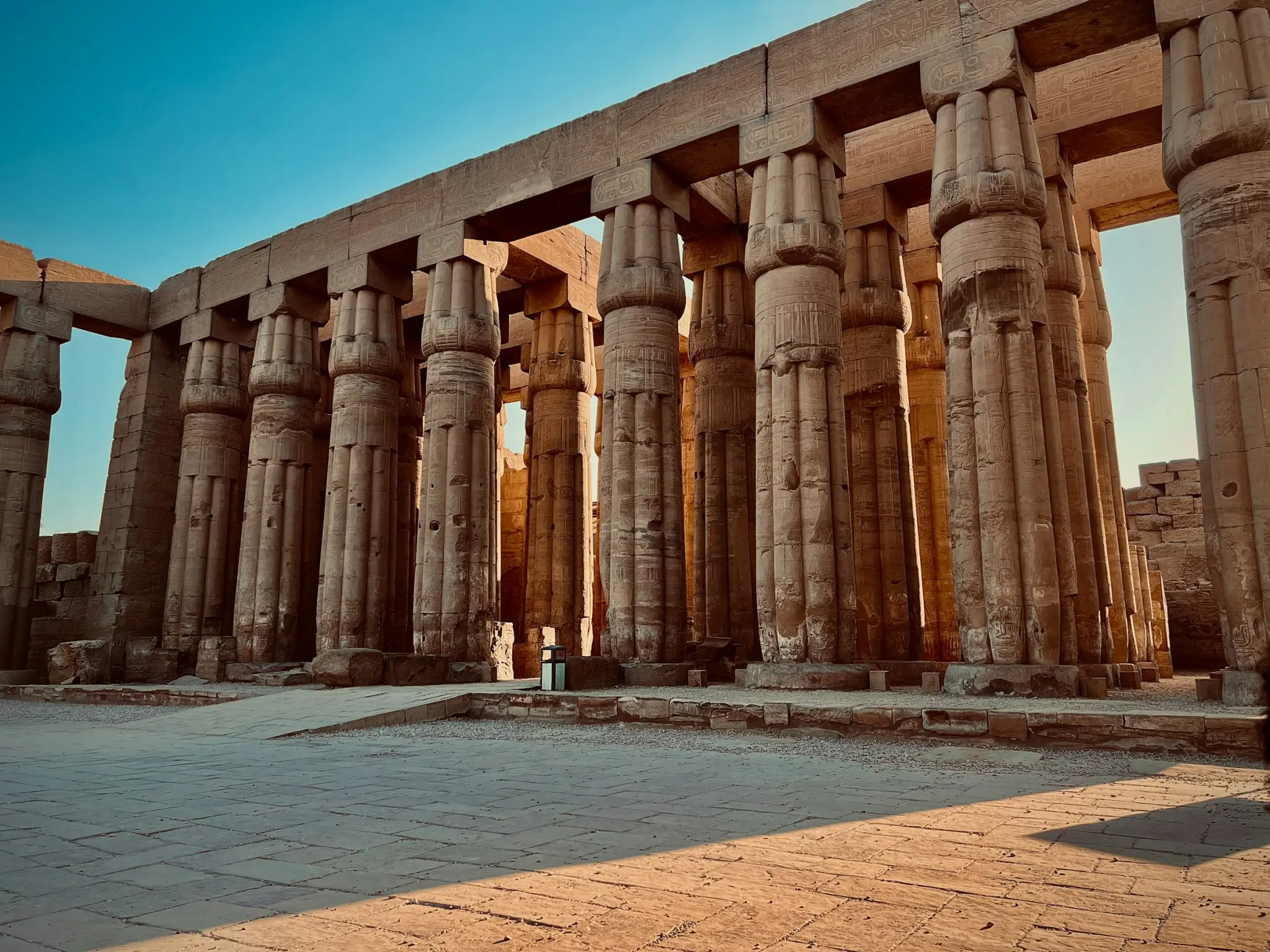 The golden columns of Luxor Temple beneath a clear sky